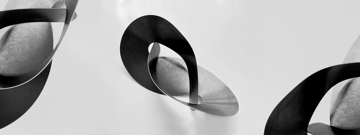 Flat Knot steel fruit bowl centrepiece by Ronen Kadushin for Cyrcus Design, geometric contemporary table sculpture.