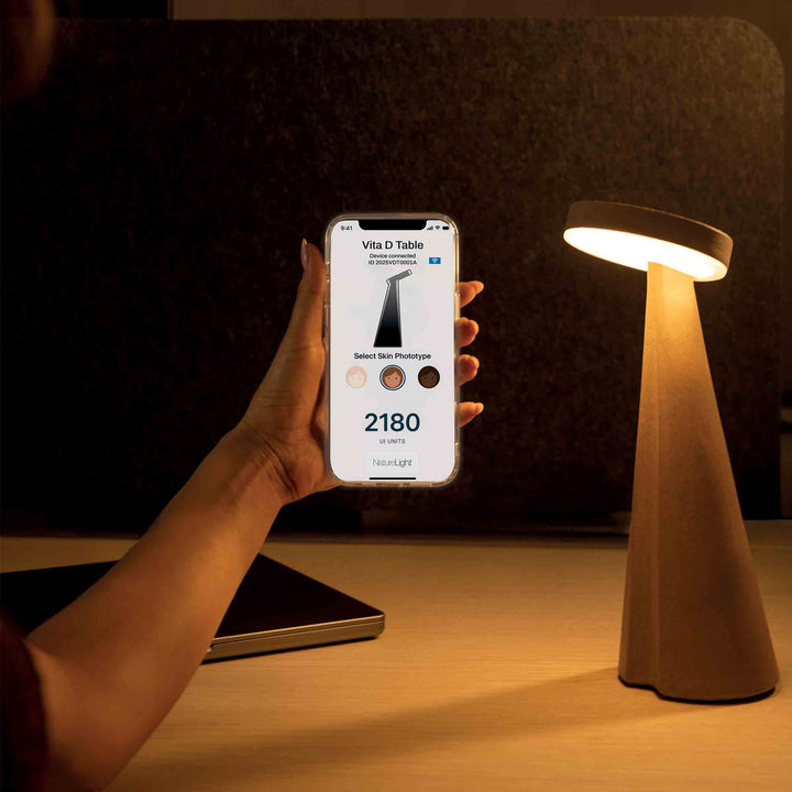 Vita D Table lamp with smart sensors, touch-dimmable lighting, and a rechargeable battery