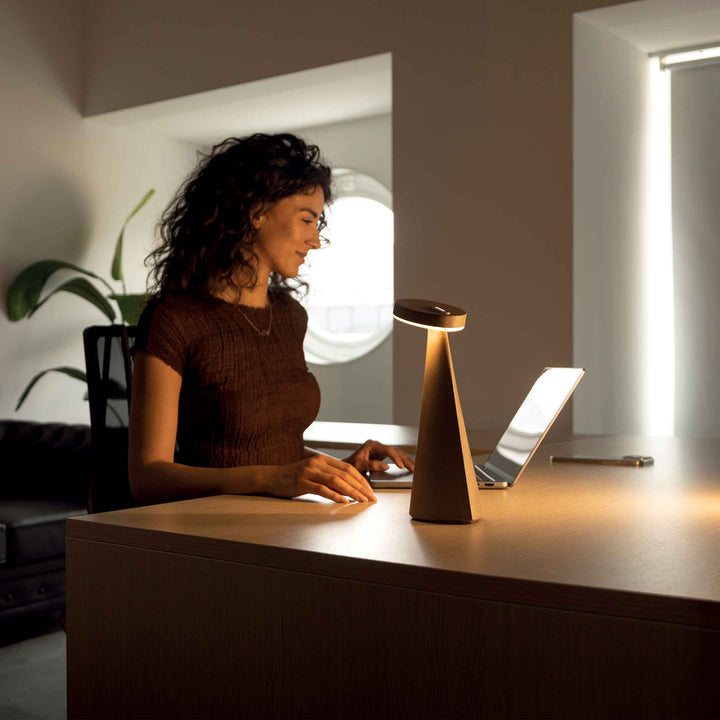 Vita D Table lamp with smart sensors, touch-dimmable lighting, and a rechargeable battery