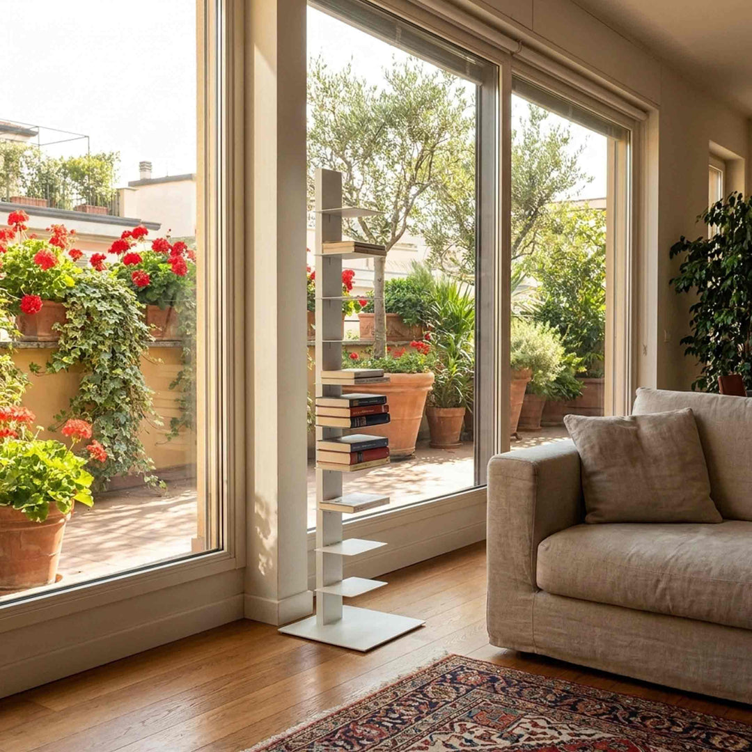 white bookcase sapiens by bbb italia in a living room