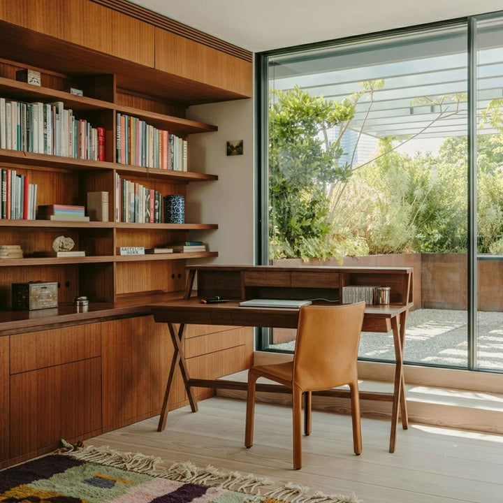 Cognac Leather Chair CAB 412 by Cassina with the  writing Desk NAVARRA by Riva 1920 in a home office