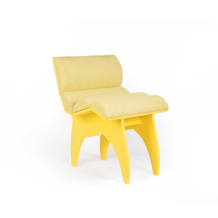 Calder Yellow chair by Jules Regis, bright yellow structure with soft cushions, contemporary designer seating.