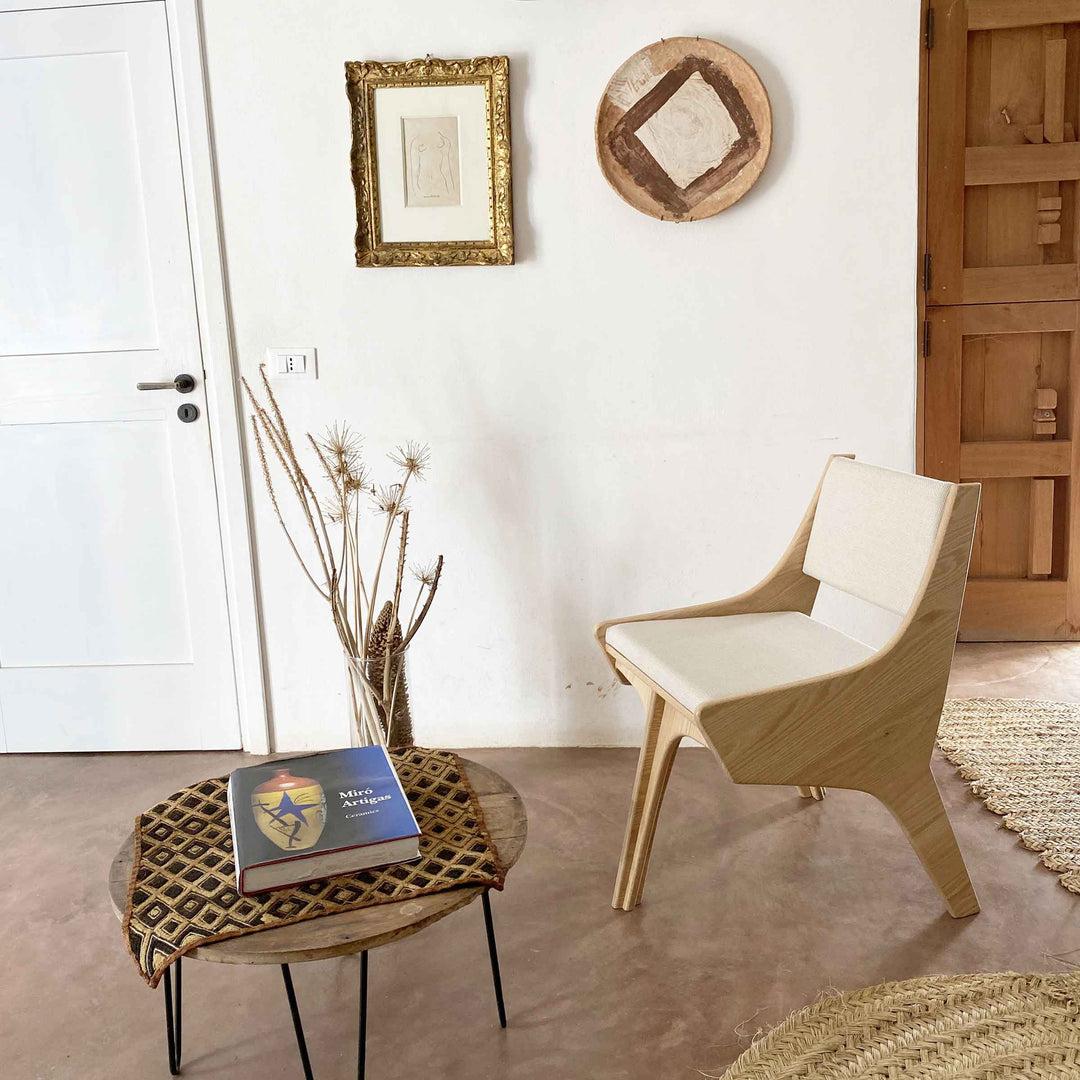 Falcone Cream chair by Jules Regis, oak wood structure with cream fabric upholstery, contemporary designer seating indoors