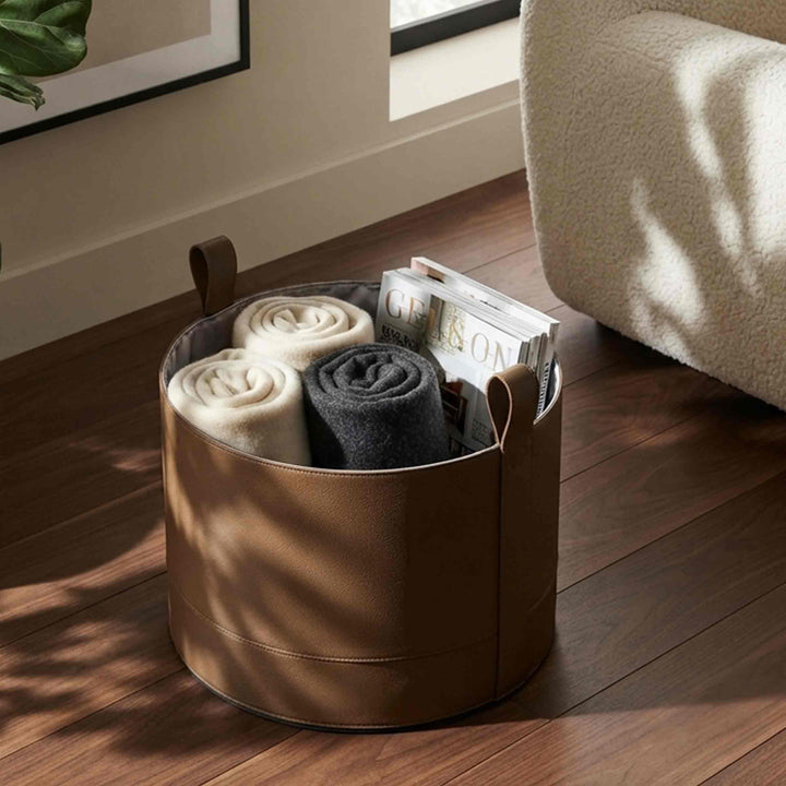 container leather basket by poltrona frau on palquet floor