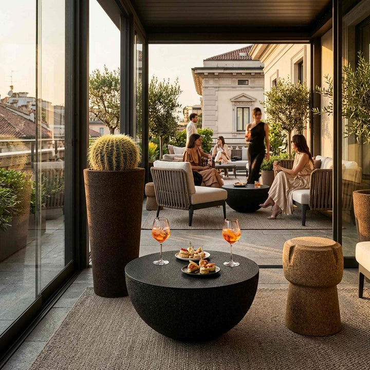 Gold Stool SPARK CORKPOUF 45 with Vase MONOLITO and Coffee Table CORBULA 60 by Suber in a terrace with people doing aperitivo