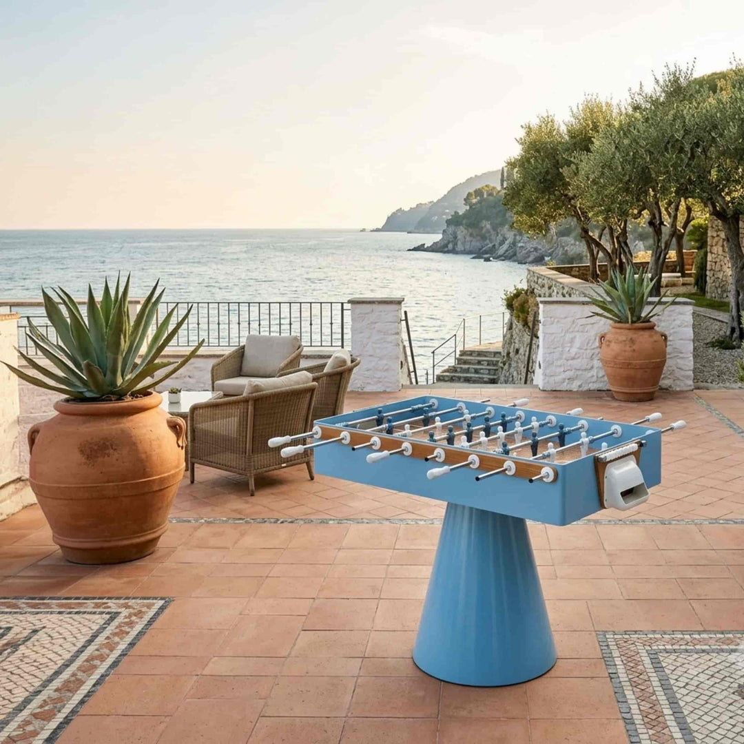 light blue foosball table ciclope capri  by FAS Pendezza in a terrace near the sea